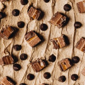 Brown butter frosting topped with mars bar and chocolate drops.