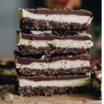 Four mint slices stacked on each other, on brown baking paper.