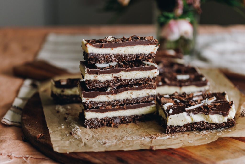 A stack of no-bake mint slice on a wooden board.